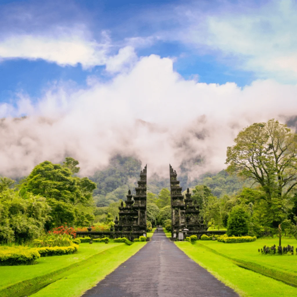 Traditional Balinese split gate with mountains behind
