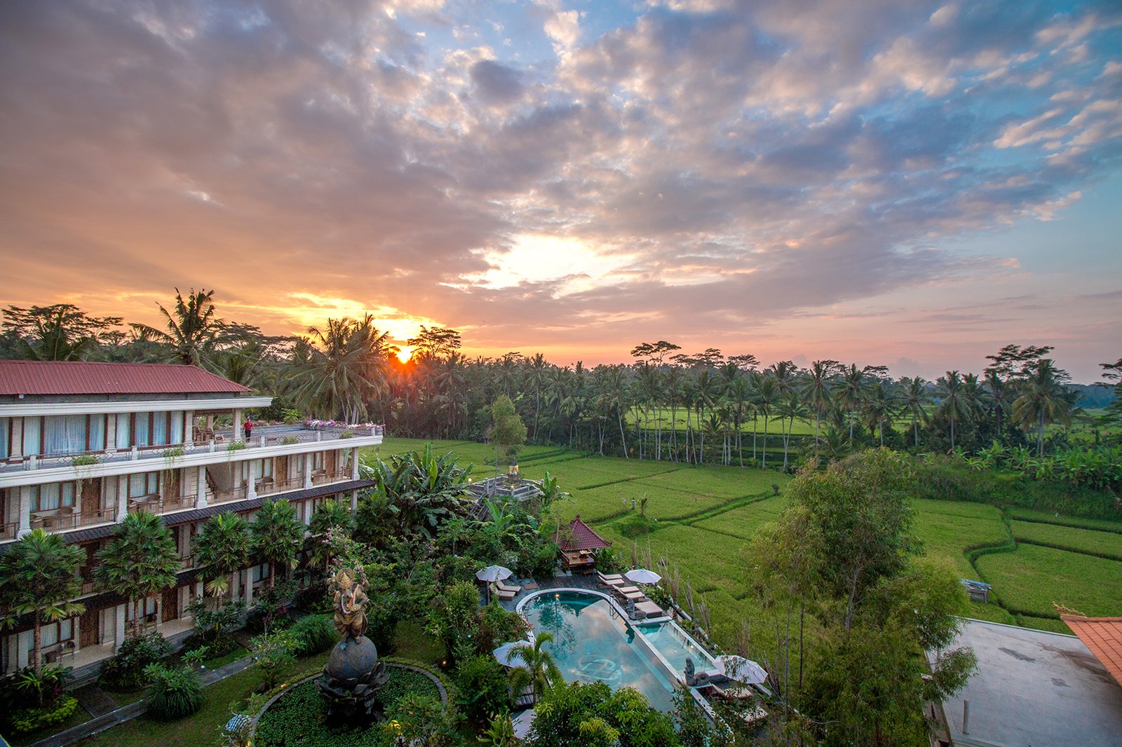 Sunrise over the yoga retreat accommodation in Ubud, Bali, surrounded by rice fields